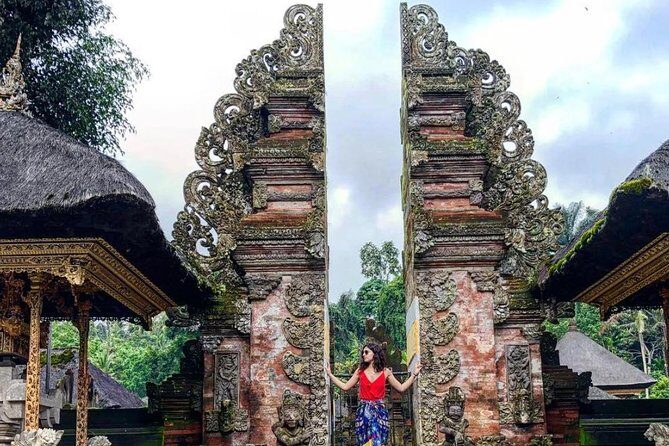 Tanah Lot Temple, Waterfall & Ubud Tour (Private & All-Inclusive) - Kanto Lampo waterfall: black rocks, split water, and a true nature payoff