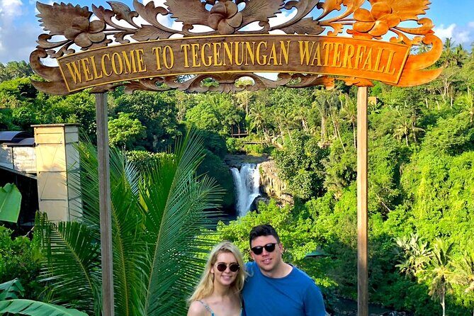 Ubud Natural Gems And Secret Waterfall Private Guided Tour - Tampaksiring: Flower-Ornamented Village Gate and Quick Photo Time